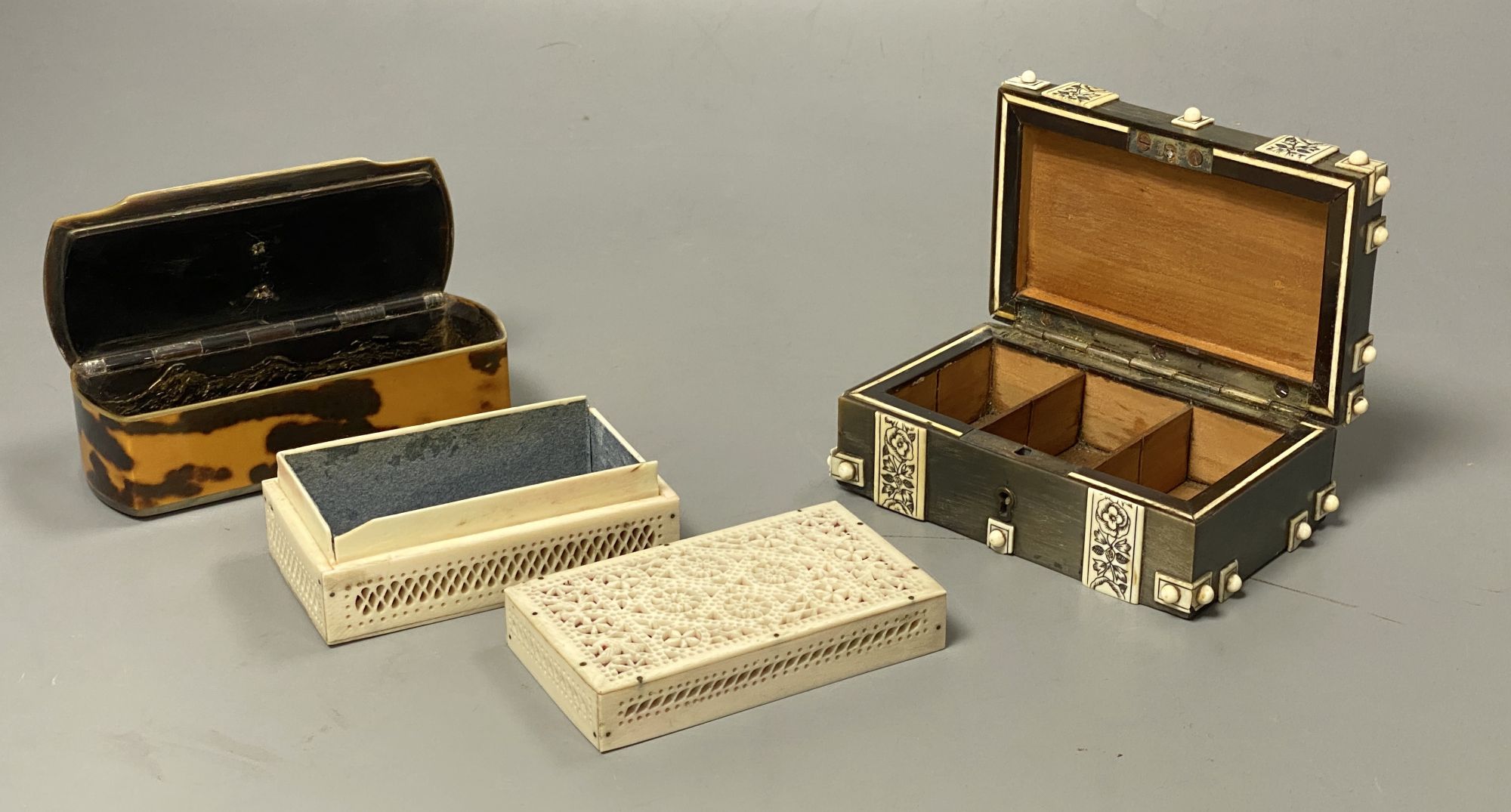 Three boxes including a horn veneered box, a tortoiseshell and bone